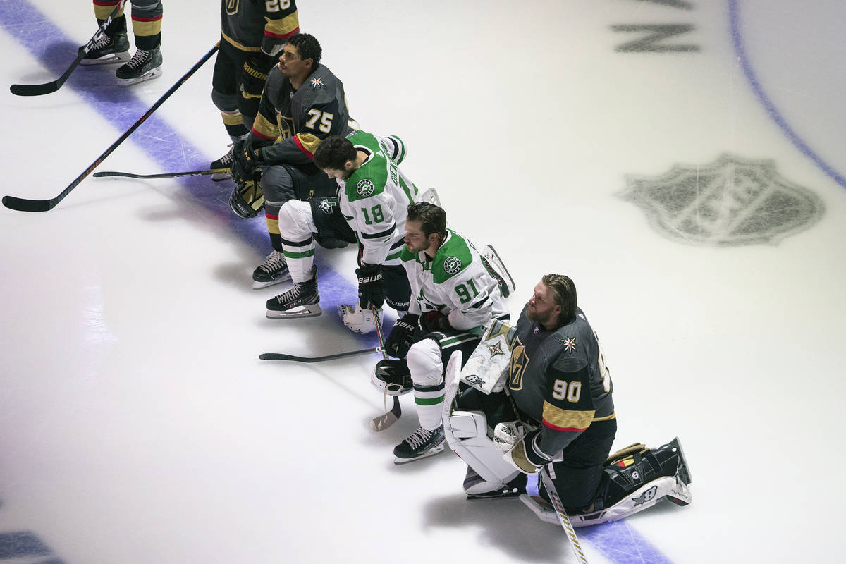 FILE - In this Aug. 3, 2020, file photo, Dallas Stars' Jason Dickinson (18), Tyler Seguin (91) ...