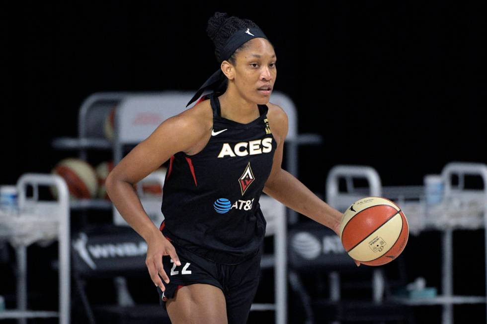 Las Vegas Aces center A'ja Wilson (22) brings the ball up the court during the first half of Ga ...