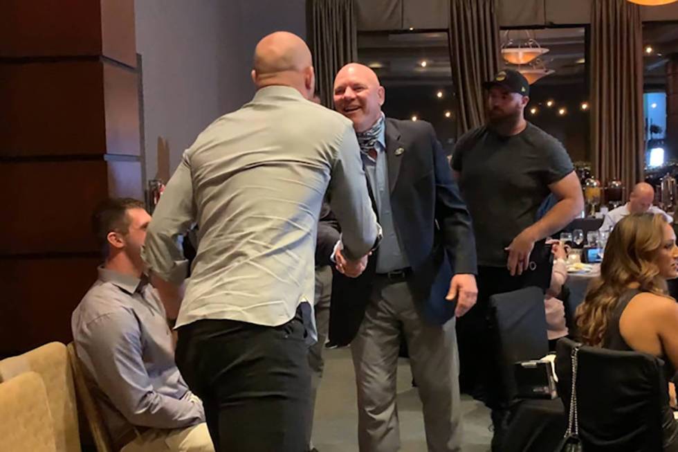 Jason Witten is seen shaking hands with Jay Schroeder, both maskless, at Darren Waller's founda ...