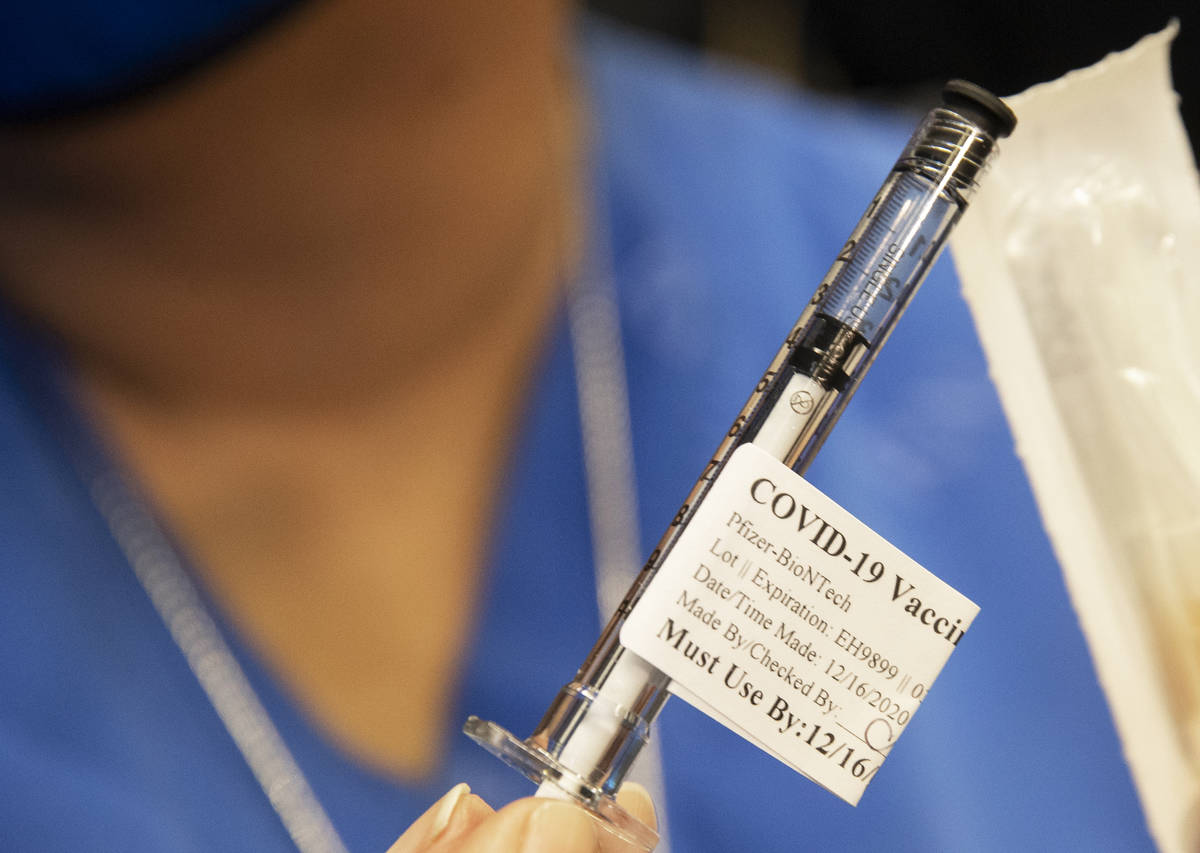 A syringe containing the COVID-19 vaccine at the North Las Vegas VA Medical Center on Wednesday ...
