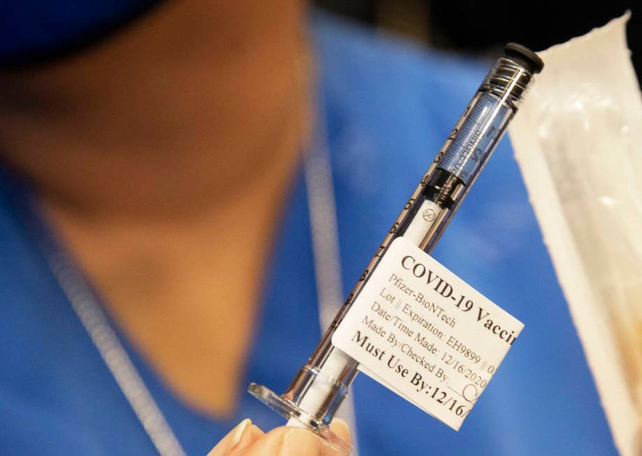 A syringe containing the COVID-19 vaccine at the North Las Vegas VA Medical Center on Wednesday ...