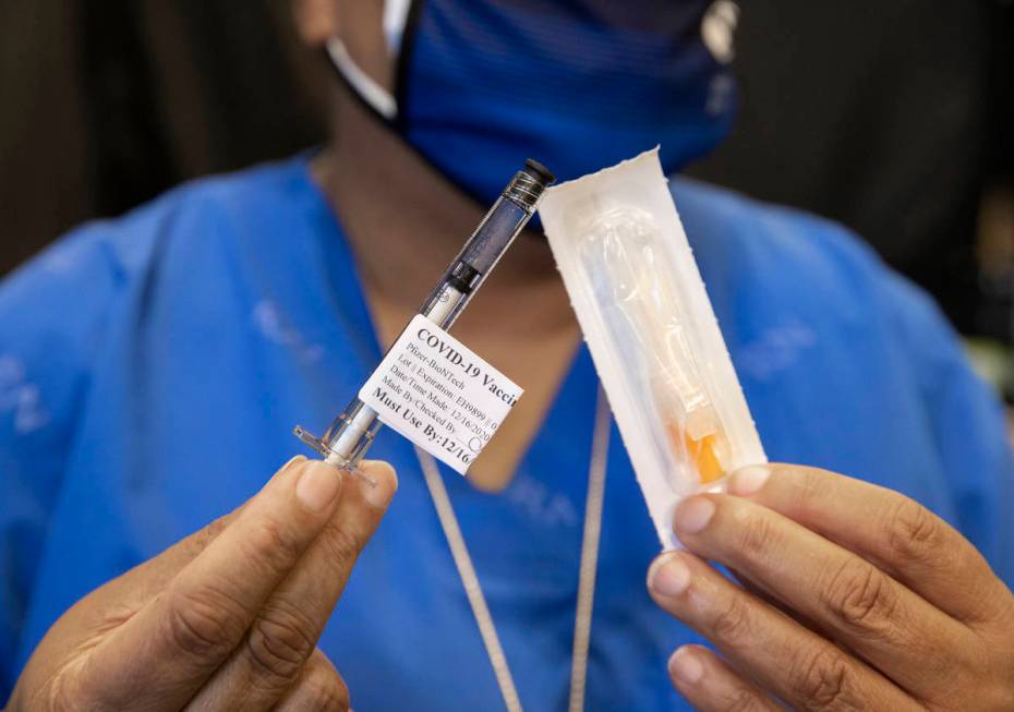 A syringe containing the COVID-19 vaccine at the North Las Vegas VA Medical Center on Wednesday ...