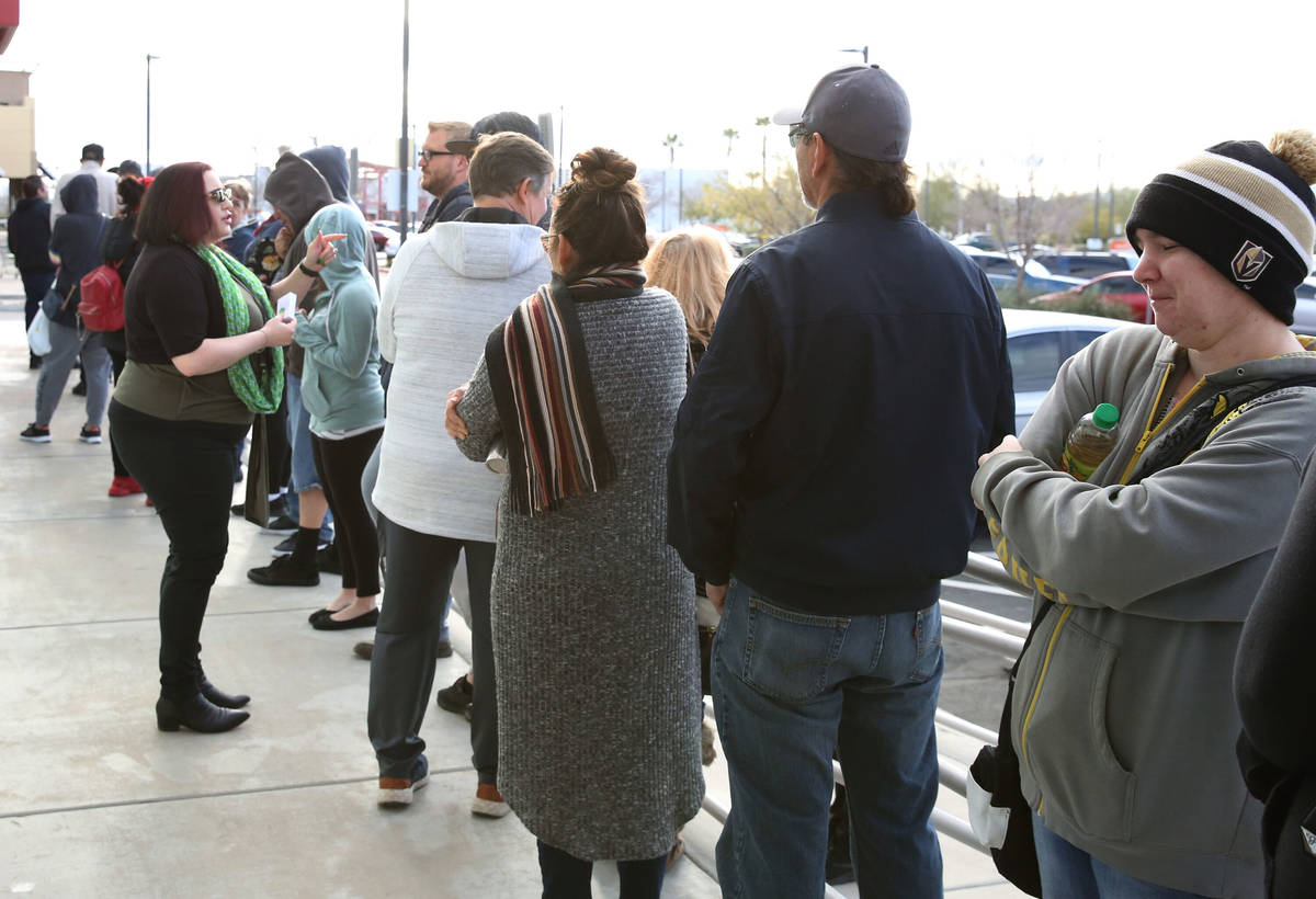 In this March 17, 2020 file photo, people wait in line at One-Stop Career Center in Las Vegas. ...
