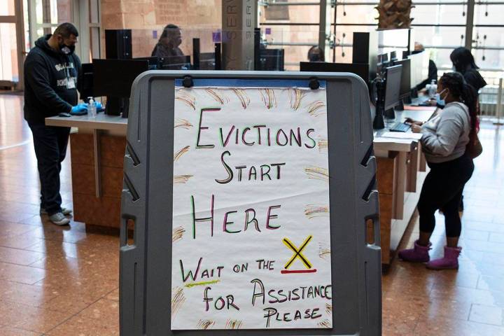 Tenants who received an eviction notice from their landlord fill out forms at the Civil Law Sel ...