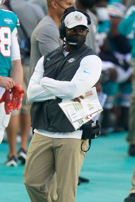 Miami Dolphins head coach Brian Flores watches his team during the second half of an NFL footba ...