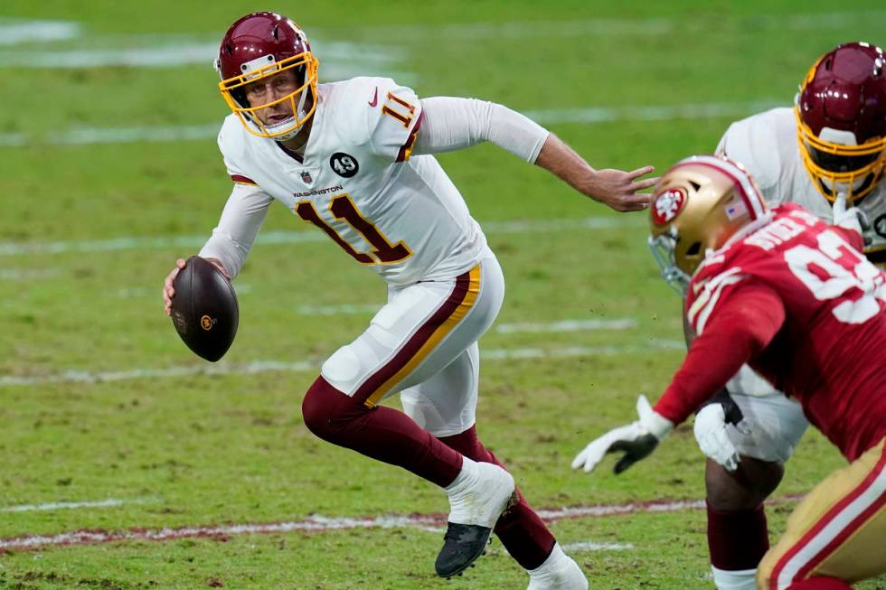 Washington Football Team quarterback Alex Smith (11) scrambles against the San Francisco 49ers ...