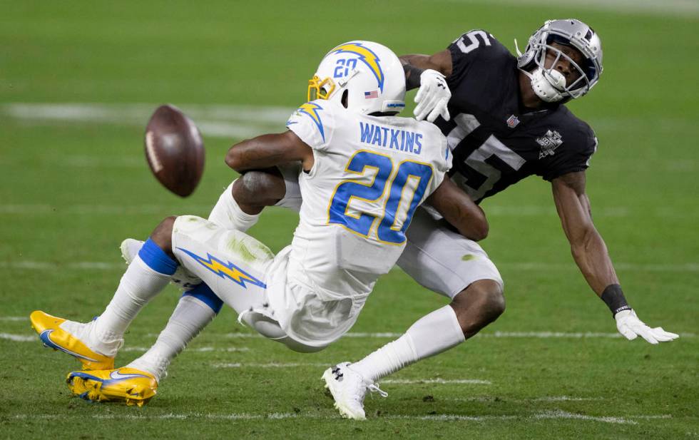 Los Angeles Chargers defensive back Jaylen Watkins (20) breaks up a pass intended for Raiders w ...
