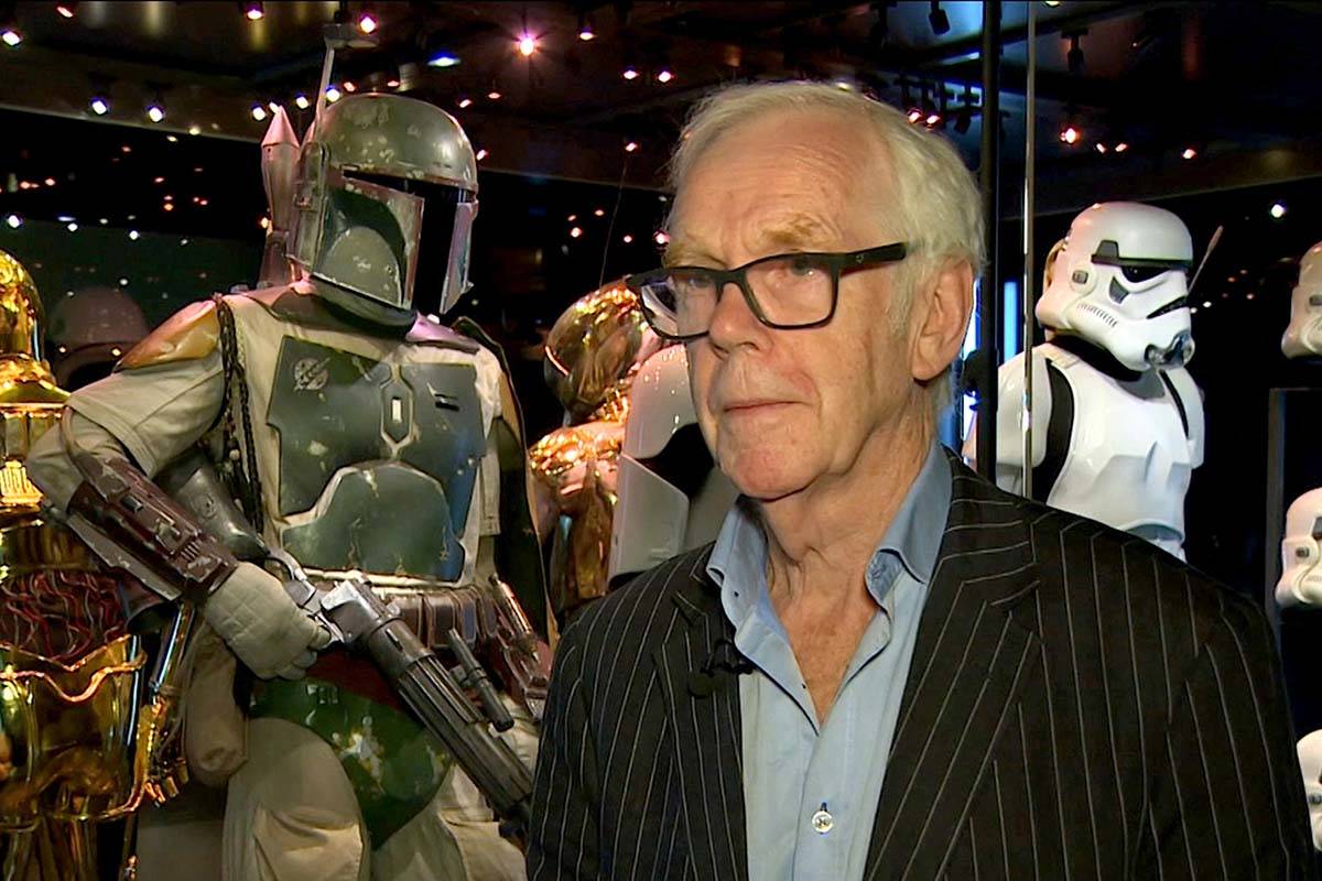 Jeremy Bulloch speaks in front of the costume he wore while playing Boba Fett in "Star War ...