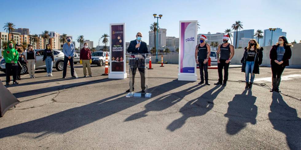 Caesars Entertainment Regional President Gary Selesner speaks while flanked by performers durin ...