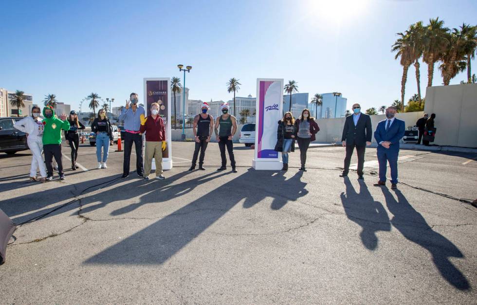 Performers and executives gather during the re-opening of the Rio on Tuesday, Dec. 22, 2020, in ...