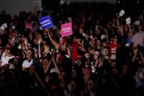 Supporters listen as President Donald Trump speaks at a rally at Minden-Tahoe Airport in Minden ...