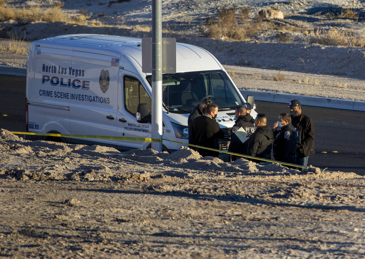 North Las Vegas Police investigate a homicide along West Brooks Avenue near Revere Street on Fr ...