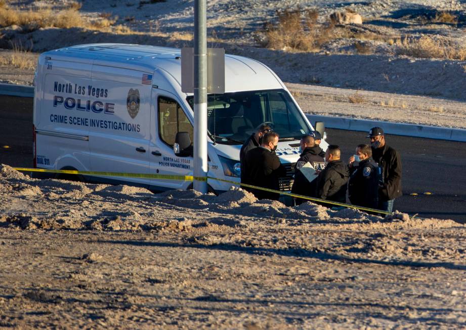 North Las Vegas Police investigate a homicide along West Brooks Avenue near Revere Street on Fr ...