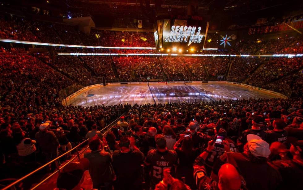 Season 3 starts sign above the crowd and on the ice before the start of the first period of the ...