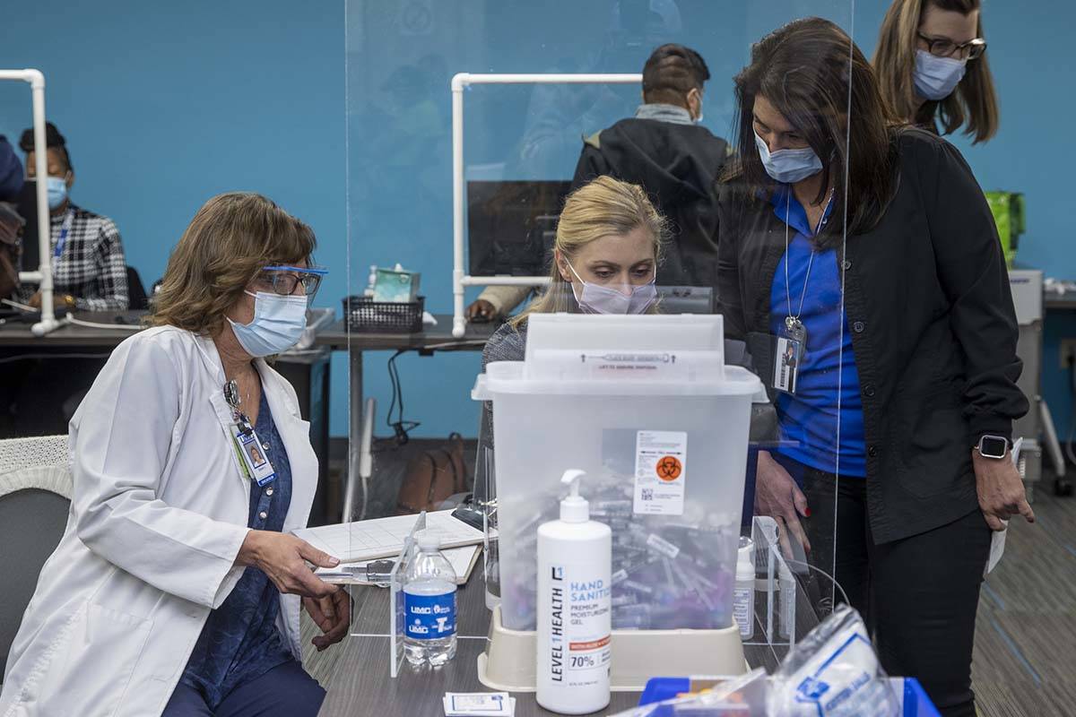 University Medical Center personnel set up for front-line health care workers to receive their ...