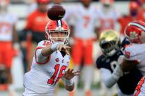 Clemson quarterback Trevor Lawrence (16) throws to an open receiver during the first half of th ...