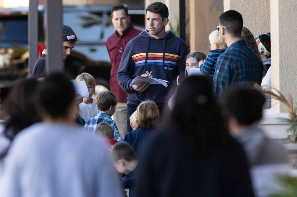 Church members congregate outside Calvary Chapel Lone Mountain before the 11 a.m. service on Su ...