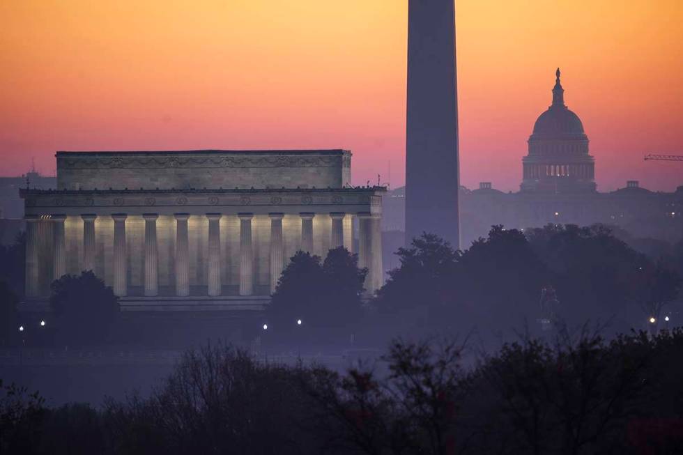 In this Nov. 8, 2020, file photo, the Washington skyline is seen at dawn with from left the Lin ...