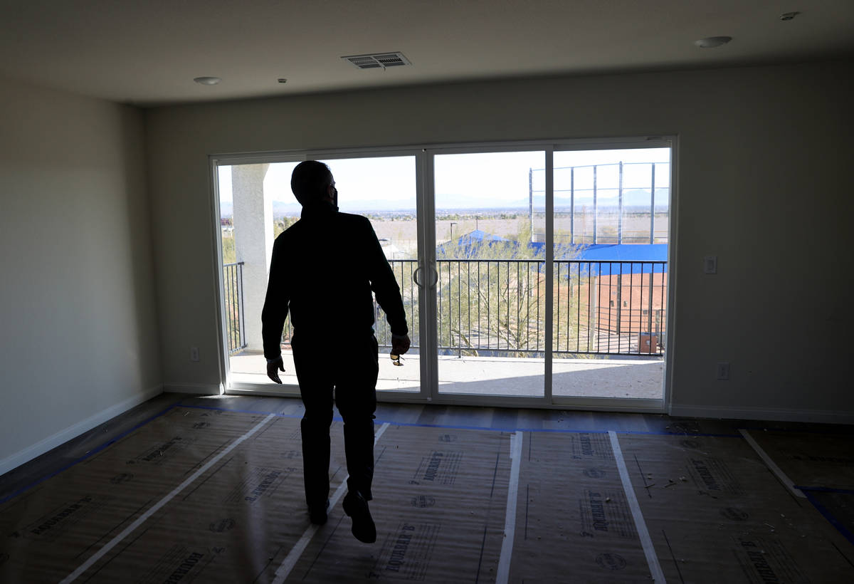 Tom McCormick, founder, Touchstone Living looks at the view of the Strip at his Panorama housin ...