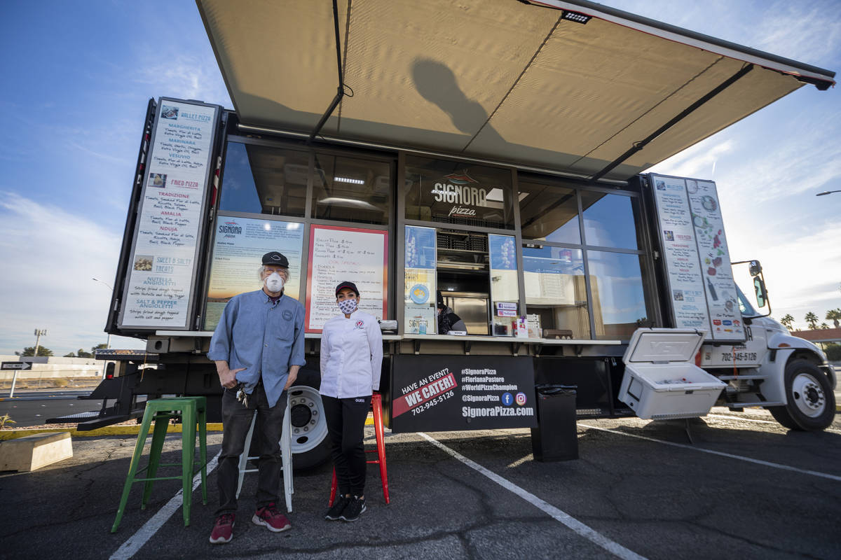 The Pinball Hall of Fame owner Tim Arnold, left, and owner Floriana Pastore is seen in front o ...