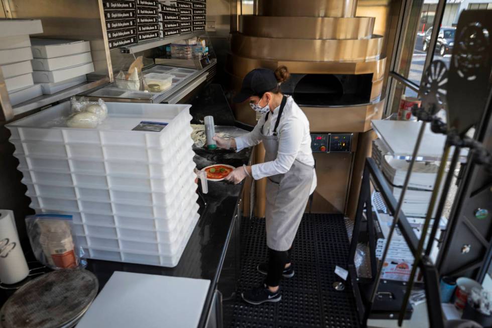 Chef Floriana Pastore is seen in the Signora Pizza Truck parked in the the Pinball Hall parking ...