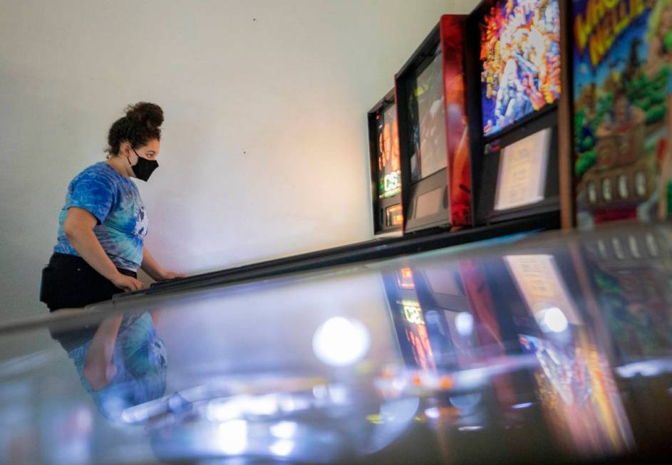 Sayler Eastin, 17, of Columbia, Mo., plays games at the Pinball Hall of Fame, during the launch ...