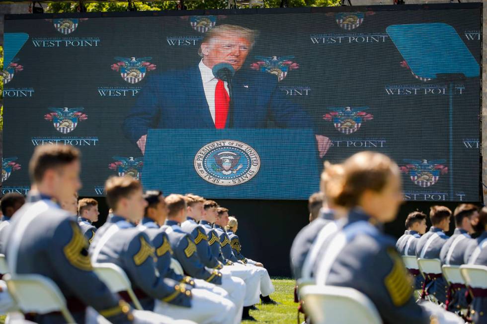 FILE - In this June 13, 2020, photo, President Donald Trump is shown on a video screen as he sp ...