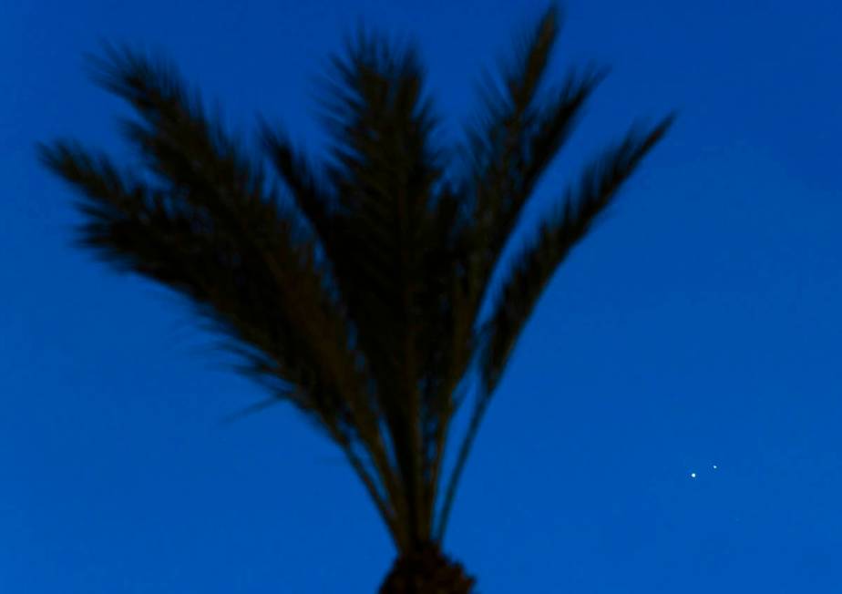 Saturn and Jupiter appear above the Strip on Monday, Dec. 21, 2020, in Las Vegas. According to ...