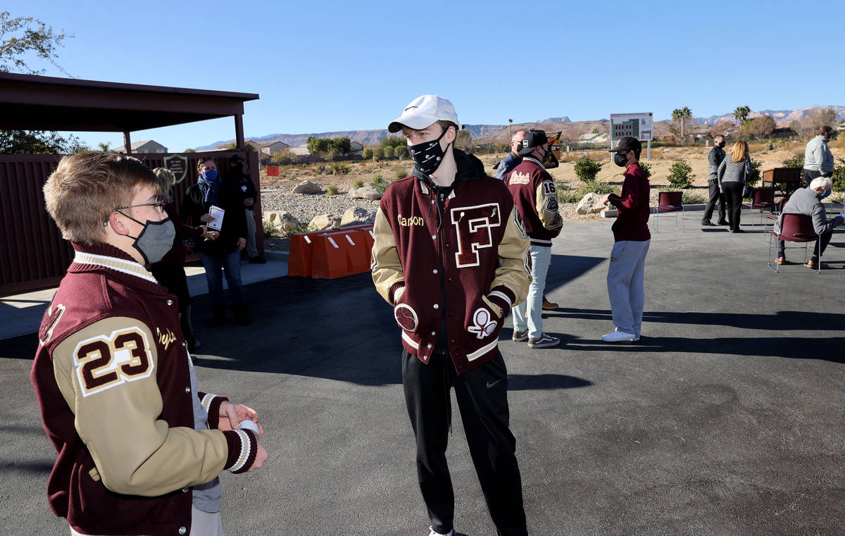 Faith Lutheran Middle School and High School tennis players, sophomore Dylan McDonnell, left, a ...