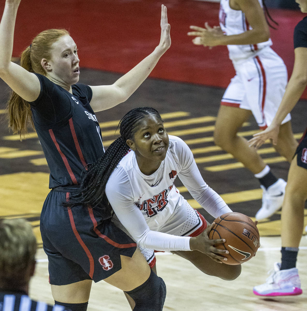 UNLV Lady Rebels forward Anna Blount (12, right) looks to the basket after getting past Stanfor ...