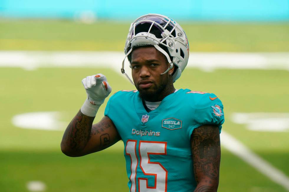 Miami Dolphins running back Lynn Bowden (15) warms up before an NFL football game against the C ...