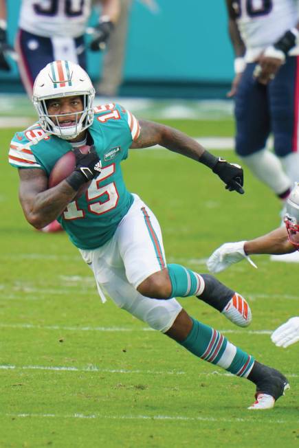 Miami Dolphins running back Lynn Bowden (15) runs the football during the first half of an NFL ...