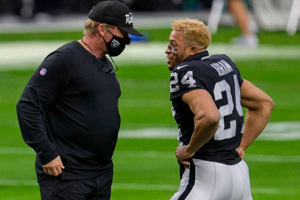 Raiders head coach Jon Gruden talks to Raiders strong safety Johnathan Abram (24) before an NFL ...