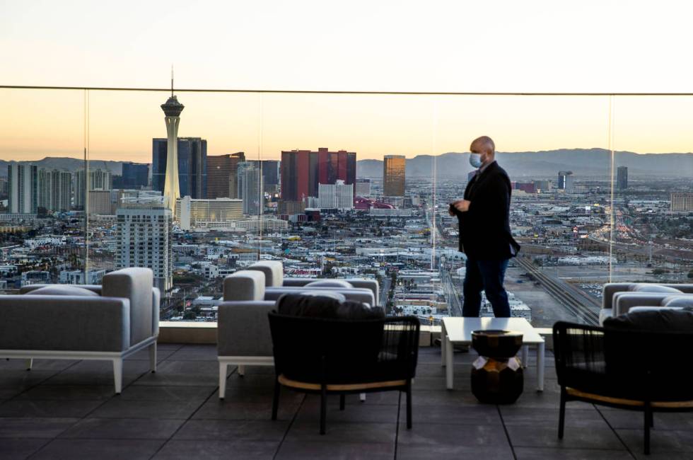 The sun sets on the city viewed from the outside deck within the Legacy Club at Circa on Tuesda ...