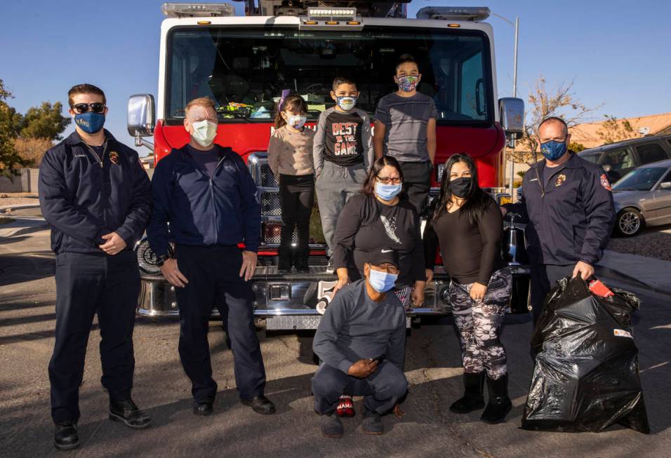 North Las Vegas Fire Truck 52 crew and family members gather after the firefighters delivered C ...