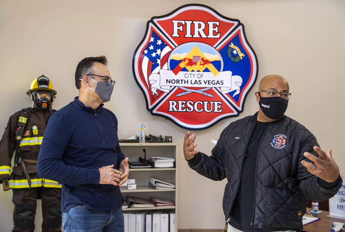 North Las Vegas Fire Captain Sergio Reynos, left, with Nino Galloway of the Firefighters of Sou ...