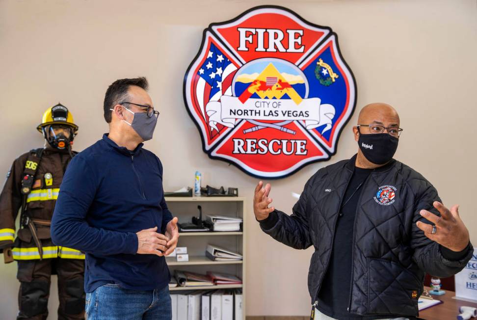 North Las Vegas Fire Captain Sergio Reynos, left, with Nino Galloway of the Firefighters of Sou ...