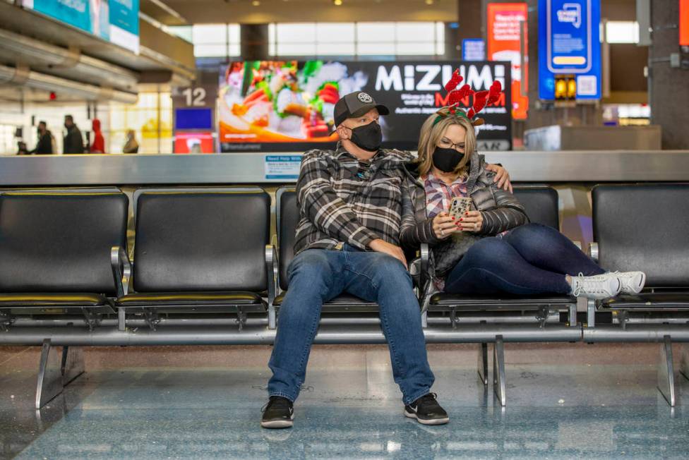 Tim, left, and Shannon Cummings of Las Vegas await the arrival of their last daughter arriving ...