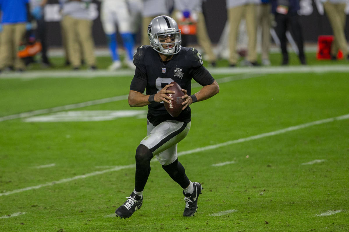 Raiders quarterback Marcus Mariota (8) runs with the football during the fourth quarter of an N ...