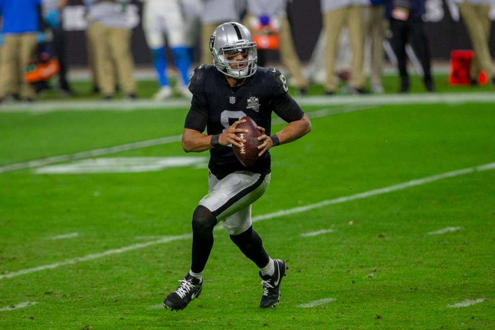 Raiders quarterback Marcus Mariota (8) runs with the football during the fourth quarter of an N ...