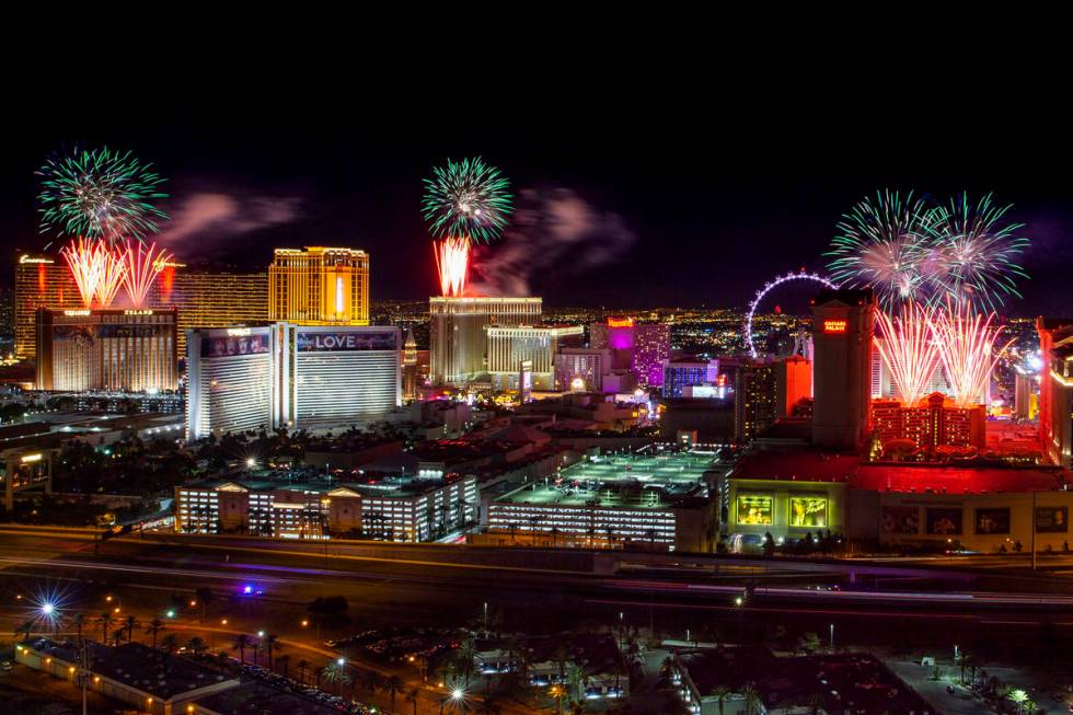 Fireworks for New Year's Eve erupt over the Strip as viewed from the VooDoo Rooftop Nightclub & ...