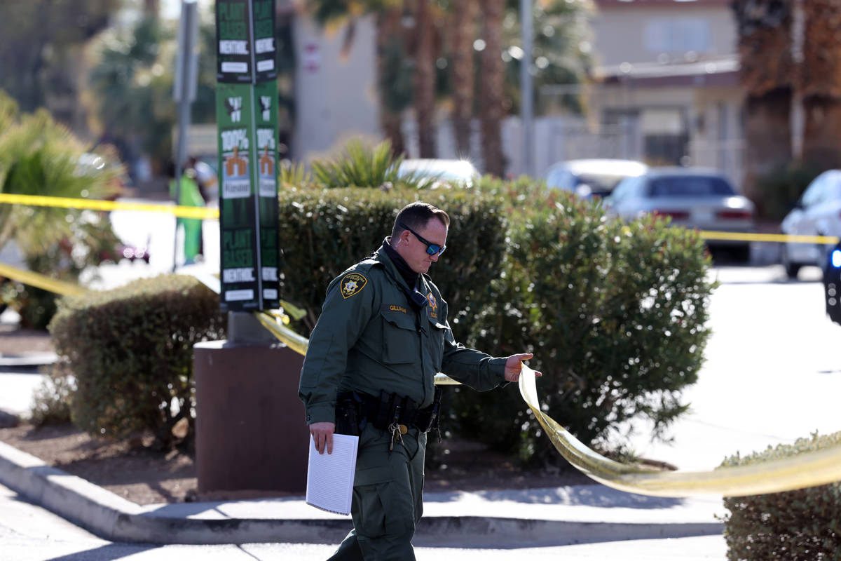 Las Vegas police investigate at the scene of a shooting on East Sahara Avenue near Paradise Roa ...