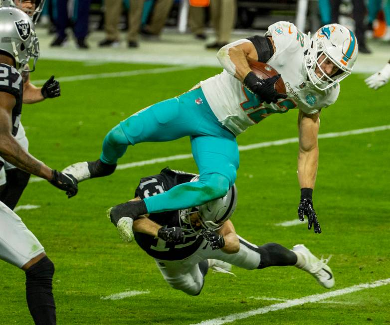 Miami Dolphins defensive back Clayton Fejedelem (42) is stopped on a touchdown run after a fake ...