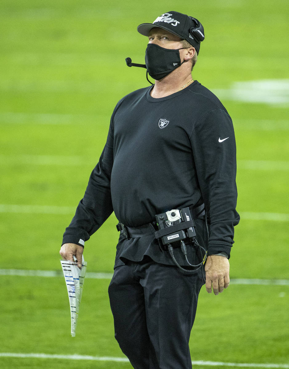 Raiders head coach Jon Gruden looks to the scoreboard on the sidelines versus the Miami Dolphin ...