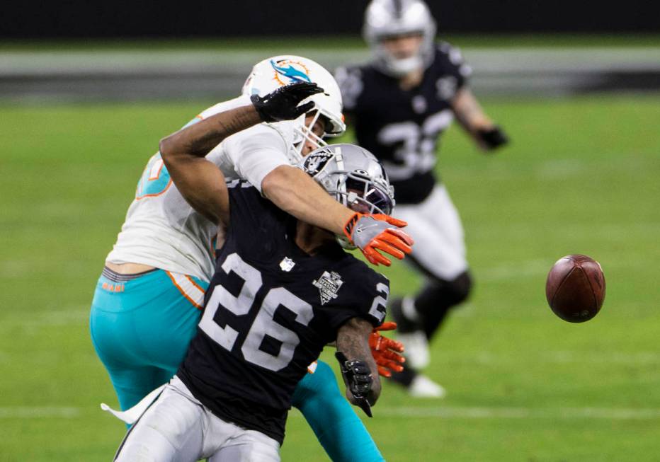 Miami Dolphins tight end Mike Gesicki (88) deflects the ball as Raiders cornerback Nevin Lawson ...