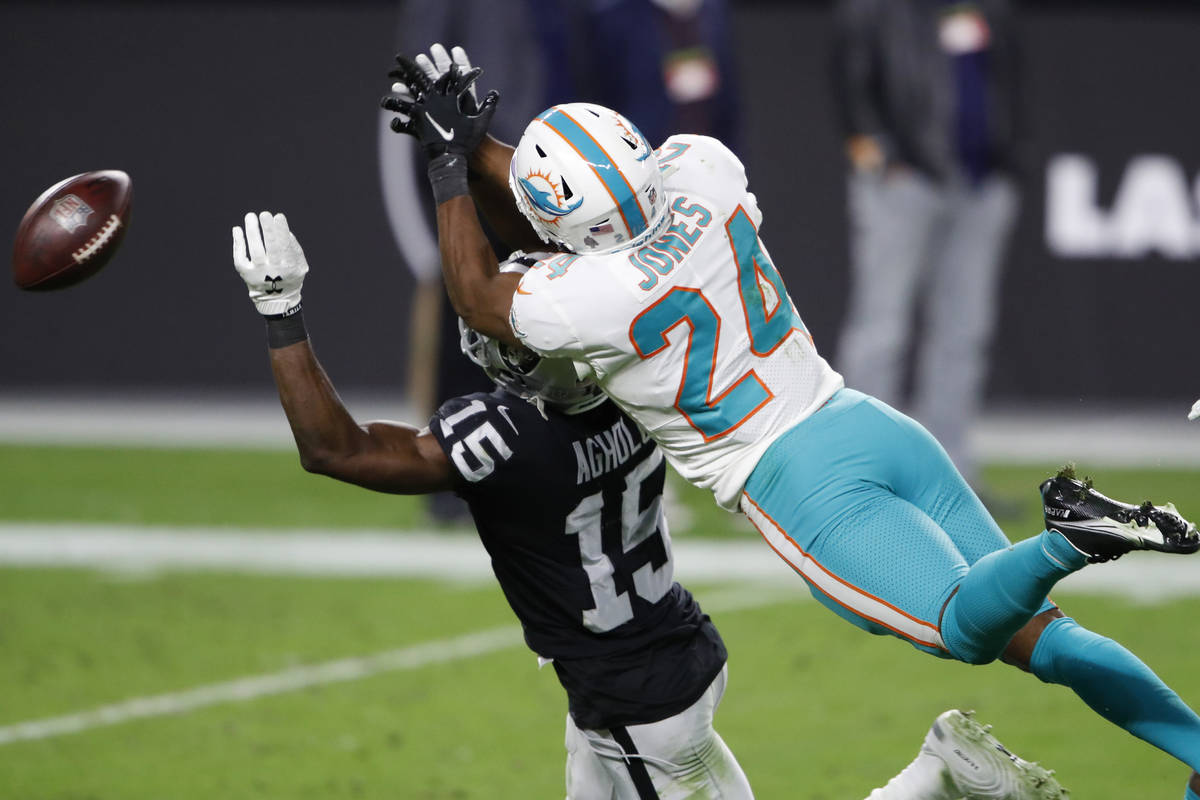Miami Dolphins cornerback Byron Jones (24) commits a pass interference penalty on Las Vegas Rai ...