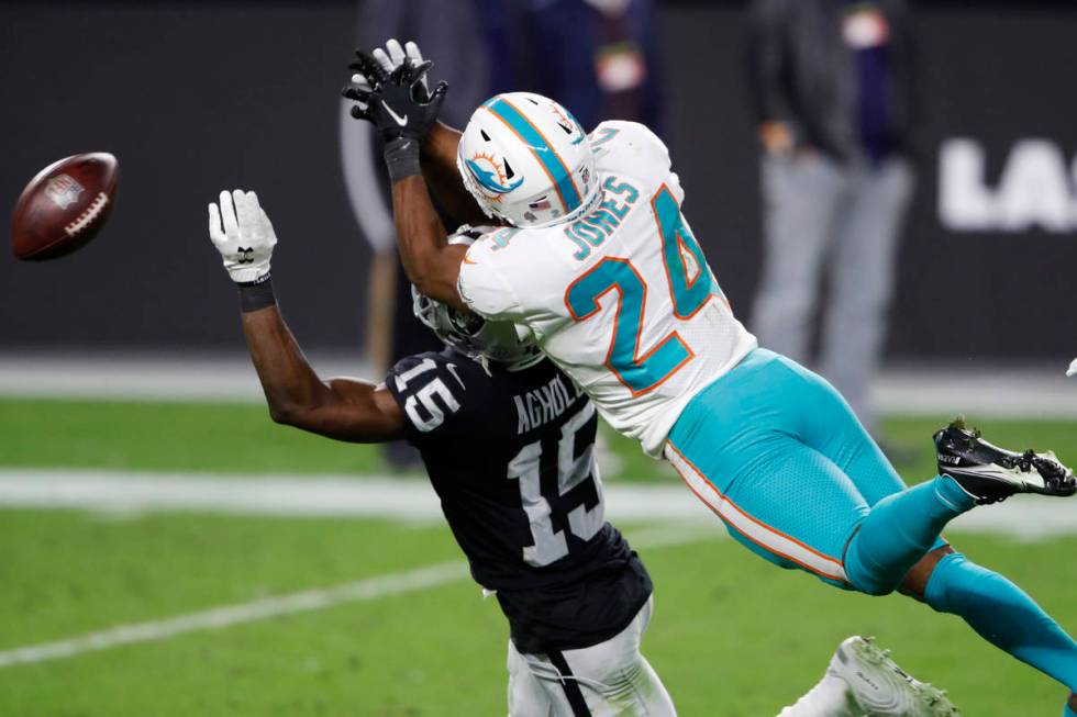 Miami Dolphins cornerback Byron Jones (24) commits a pass interference penalty on Las Vegas Rai ...