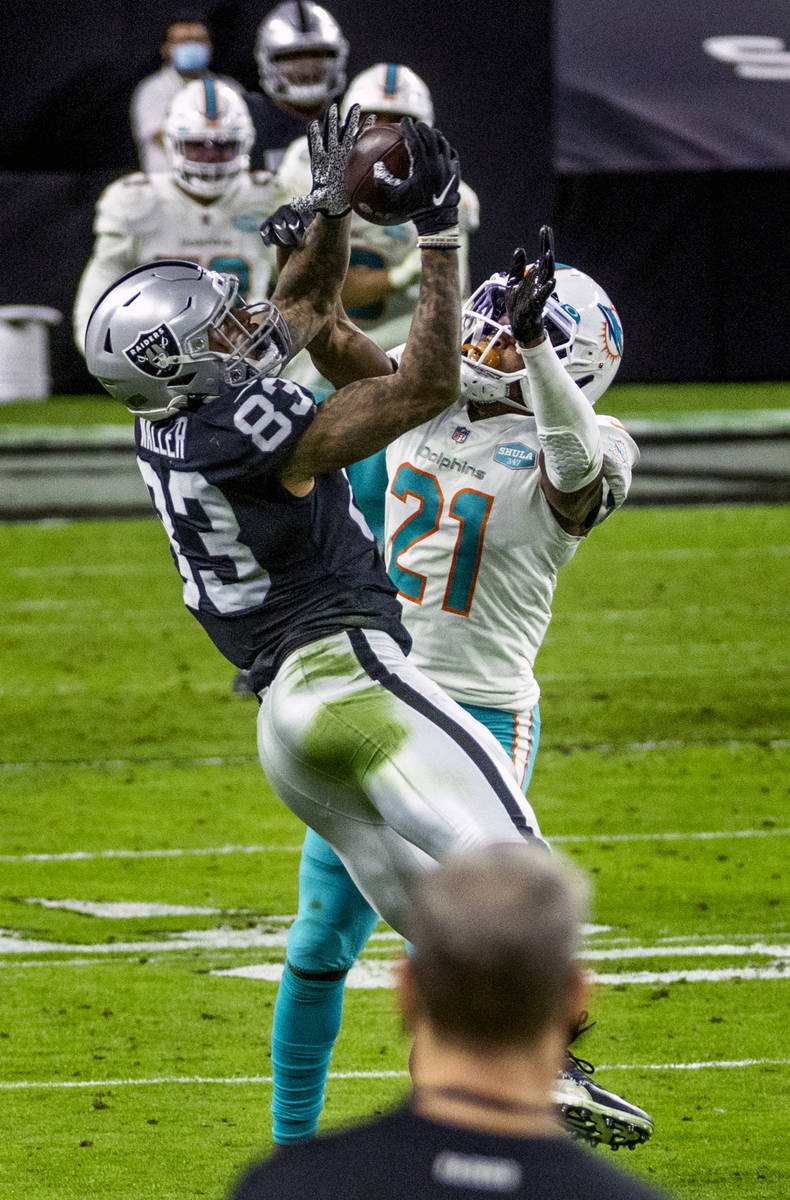 Raiders tight end Darren Waller (83) elevates to make a catch over Miami Dolphins free safety E ...