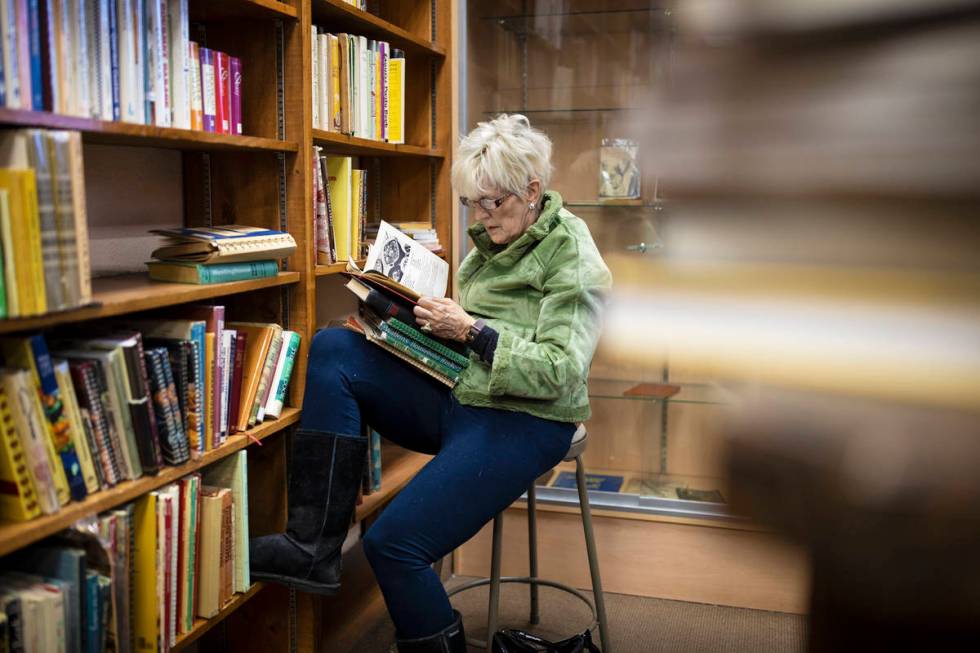 Mary Martinez shops at Amber Unicorn Books on the last business day at the Vegas landmark on Su ...