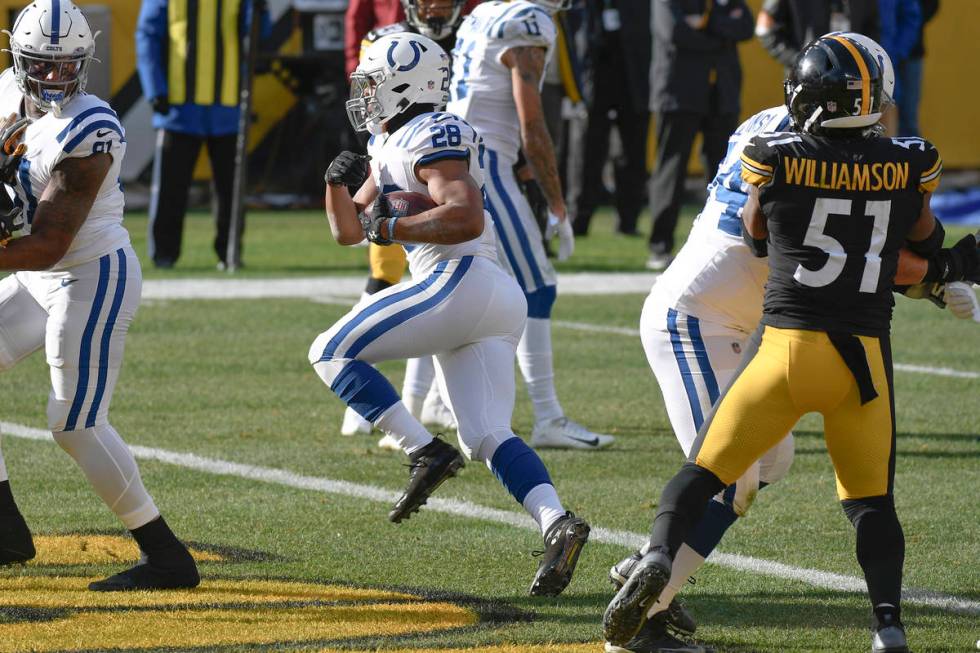 Indianapolis Colts running back Jonathan Taylor (28) scores a touchdown past Pittsburgh Steeler ...